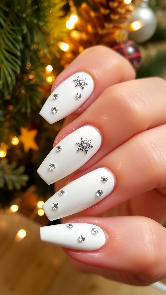 Elegant white Christmas nails with silver snowflakes and rhinestones, set against a festive holiday backdrop.